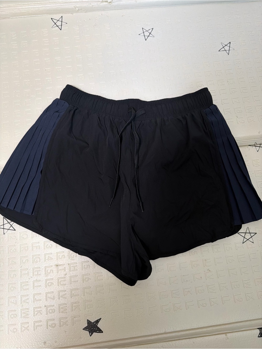 Carbon38 Black Athletic Shorts with Navy Pleated Side Panels